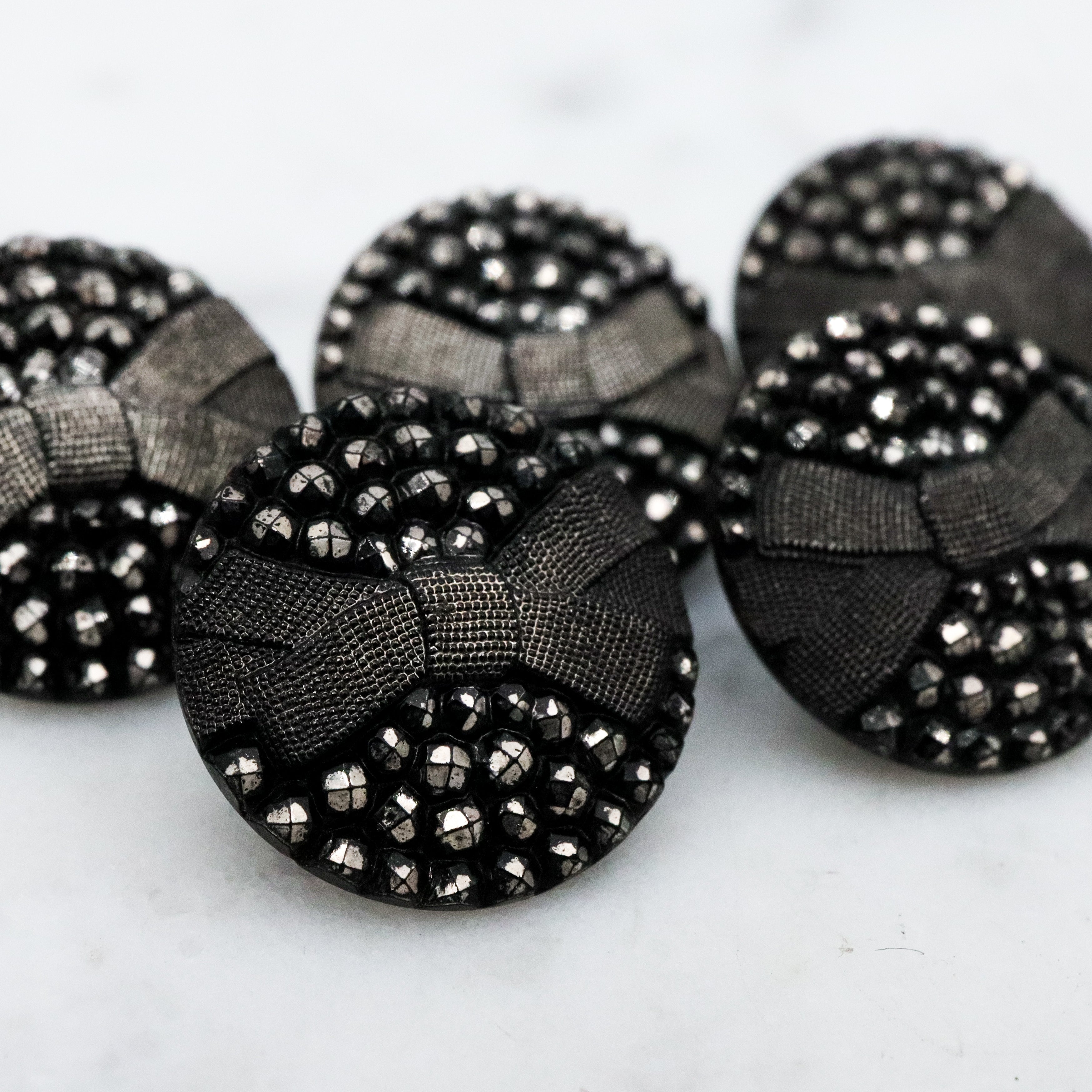 Set of 5 Antique Victorian jet black glass buttons w/silver painted rivets & bow
